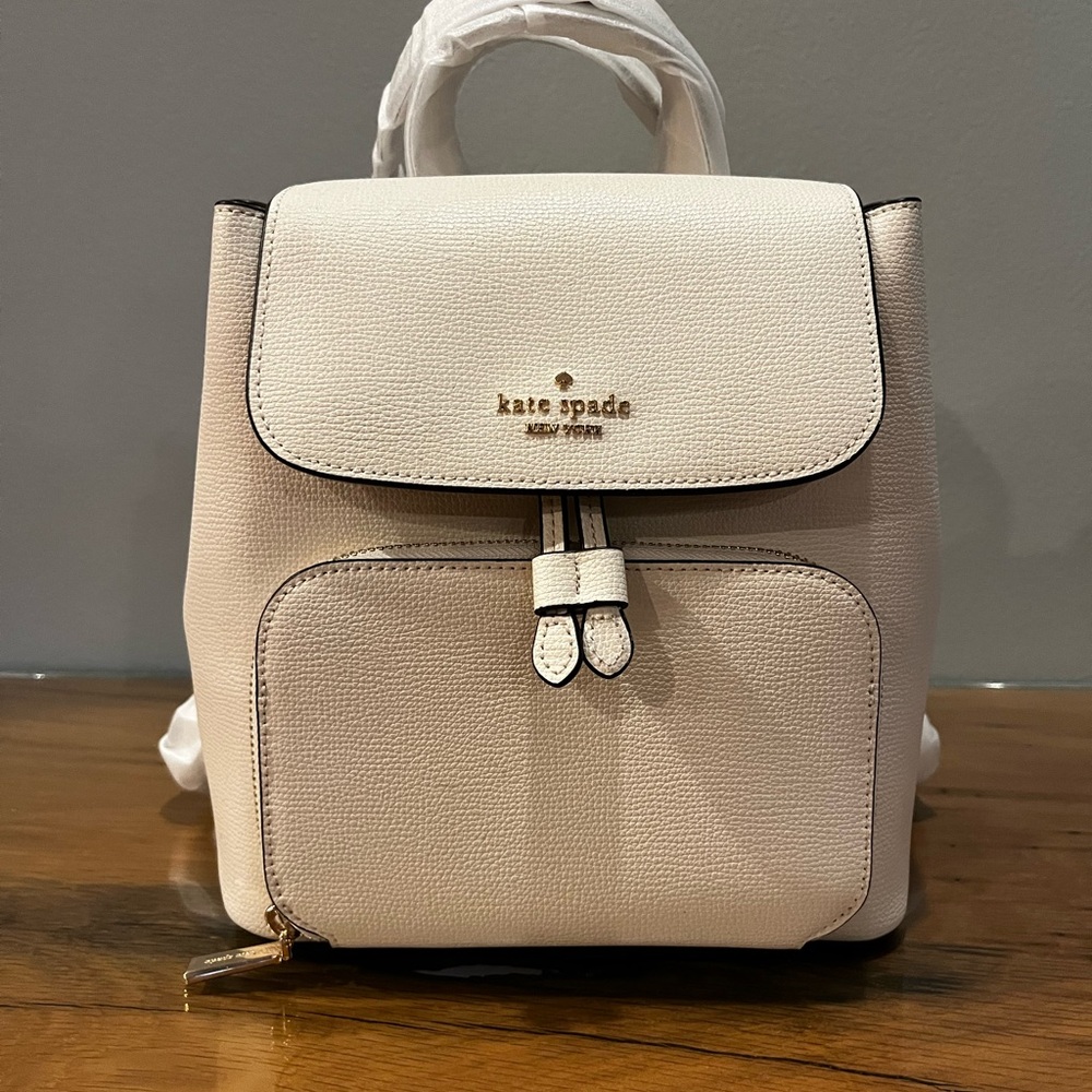 Kate Spade Cream Backpack with Flap-Over Design